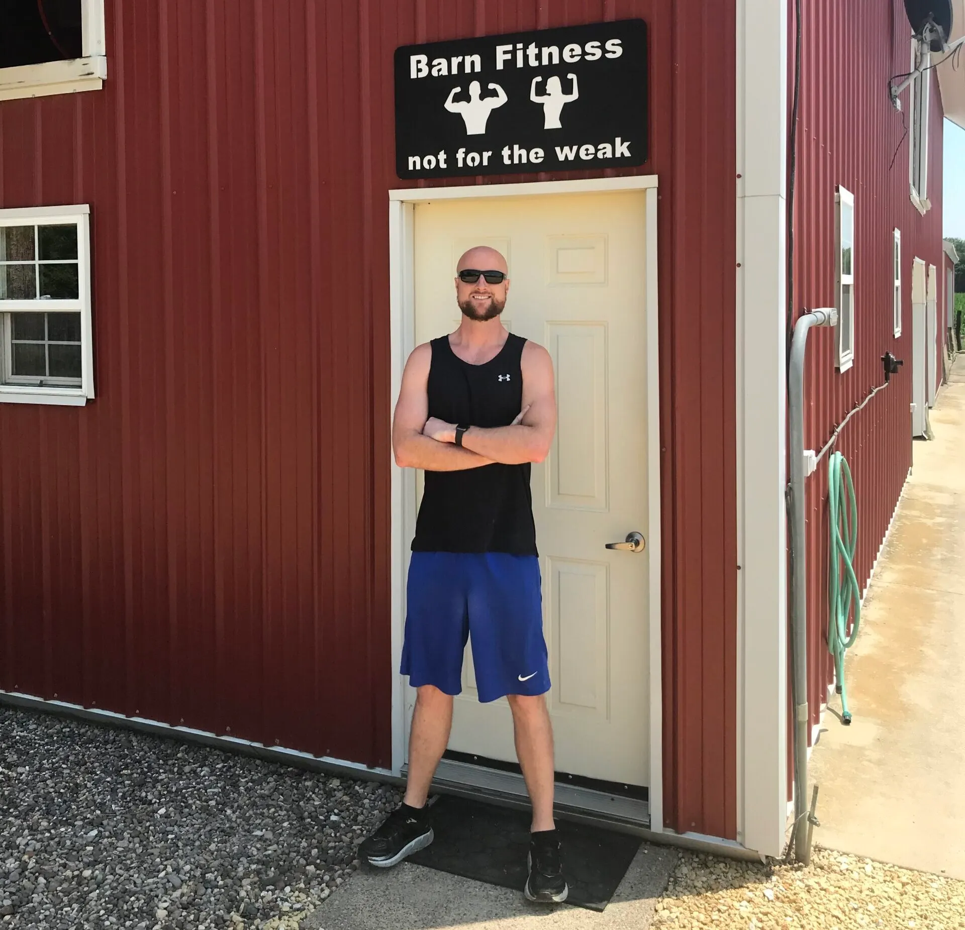 Cole Block Standing in Front of Barn