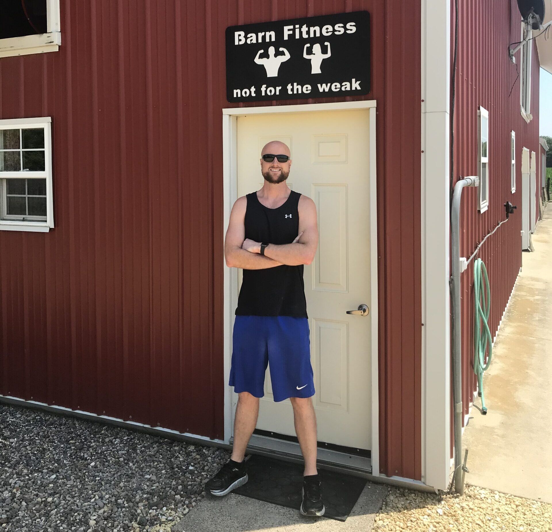 Cole Block Standing in Front of Barn